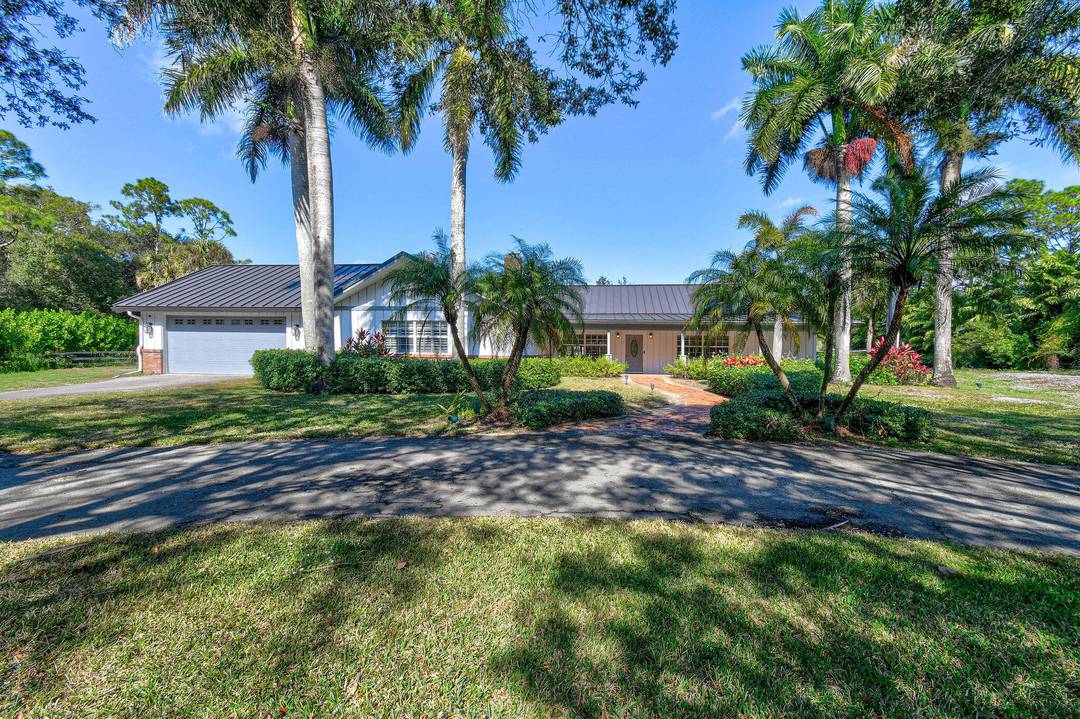 Set on 1. 69 acres in 'Loxahatchee Groves', this home offers privacy, generous space, and comfortable indoor and outdoor living.