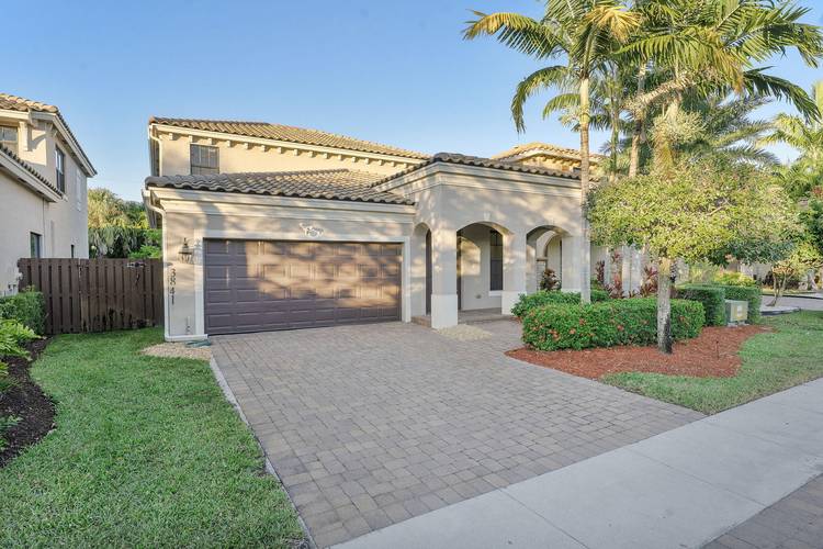Welcome to this spacious two story residence featuring a grand entrance with soaring ceilings and easy to maintain tile flooring throughout the main level.