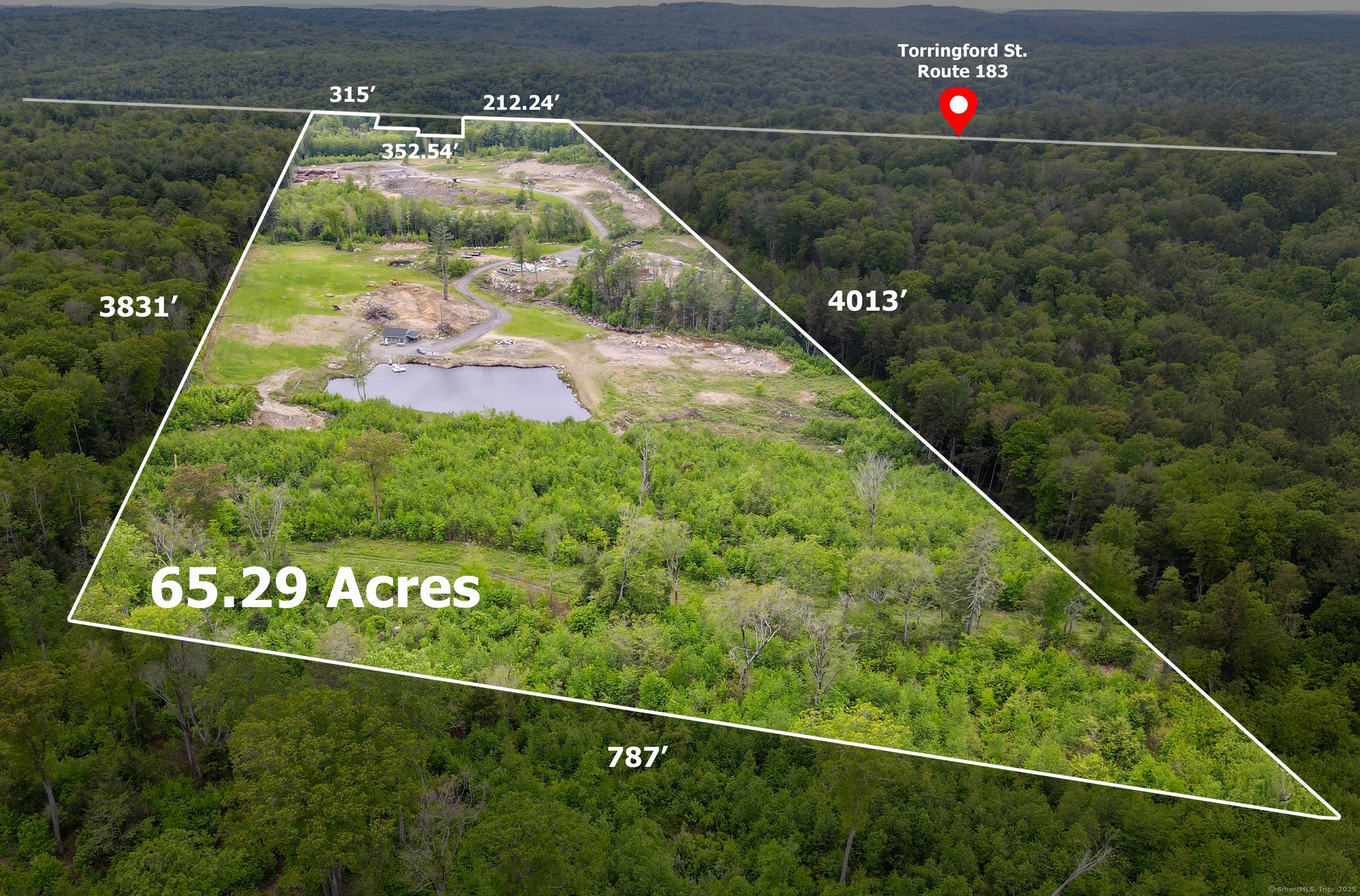 65 Acre Property with infrastructure and natural features.