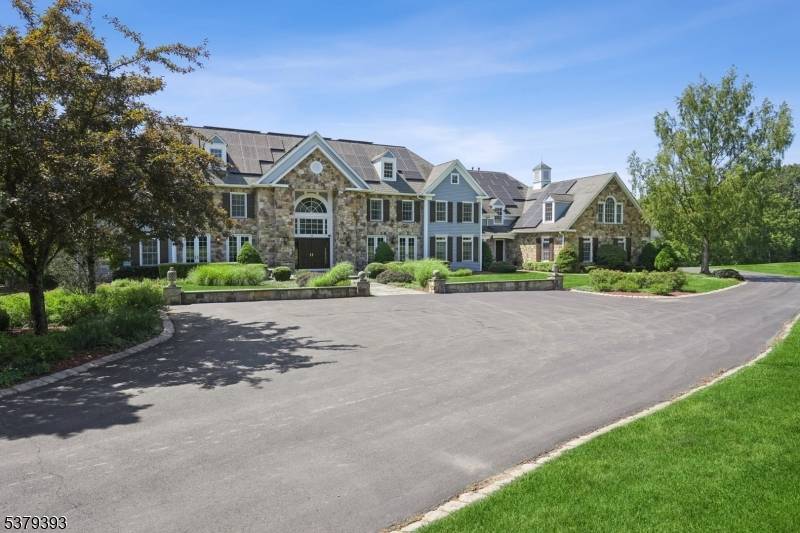 Welcome to this magnificent custom Colonial estate, gracefully set on over 10 acres of pristine land.