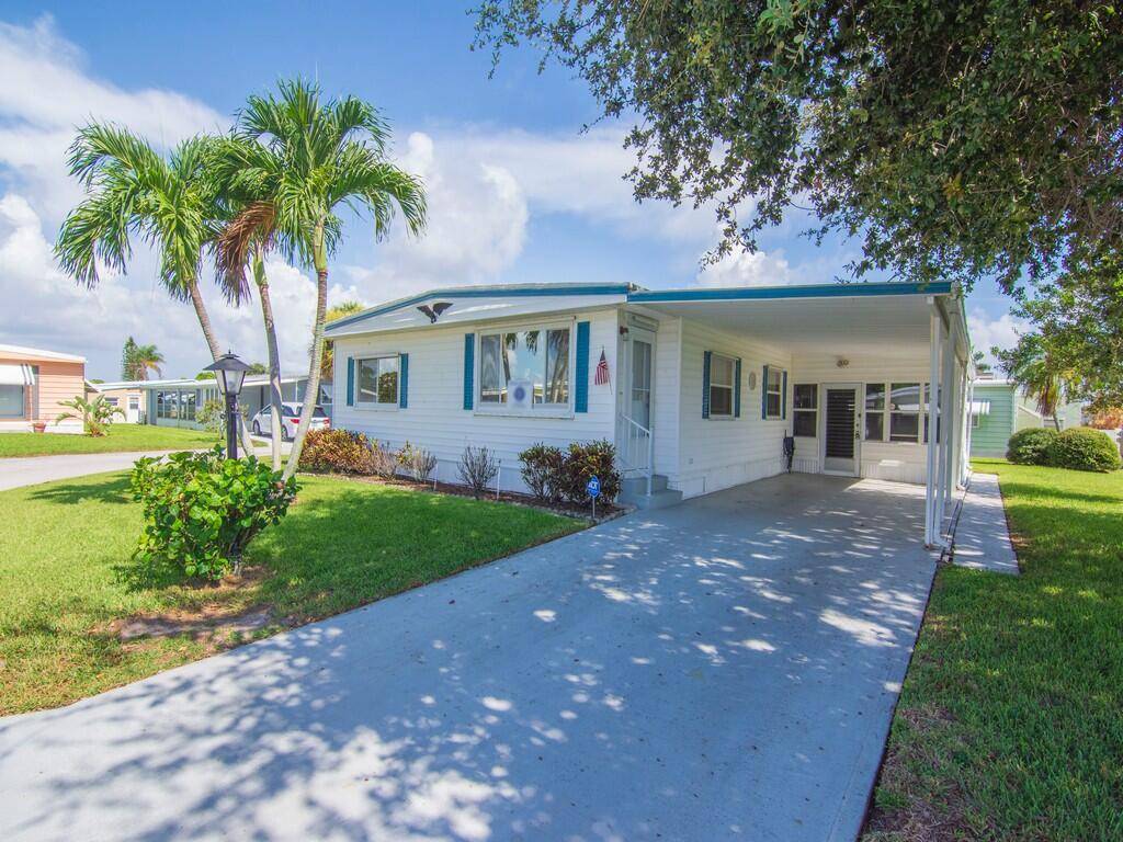 Located in the vibrant 55 community of Pinelake Village, 264 NE Cameo Way in Jensen Beach, Florida, offers a perfect blend of convenience and charm.
