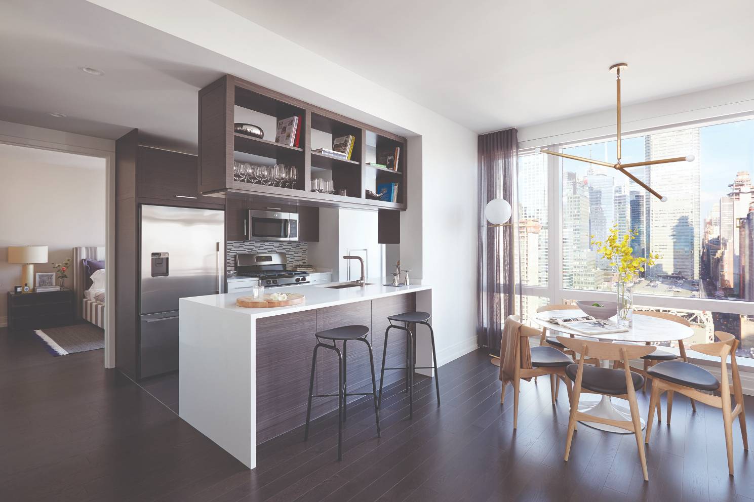 With sweeping views of the city from sunrise to sunset 555TEN towers over the new West Side.