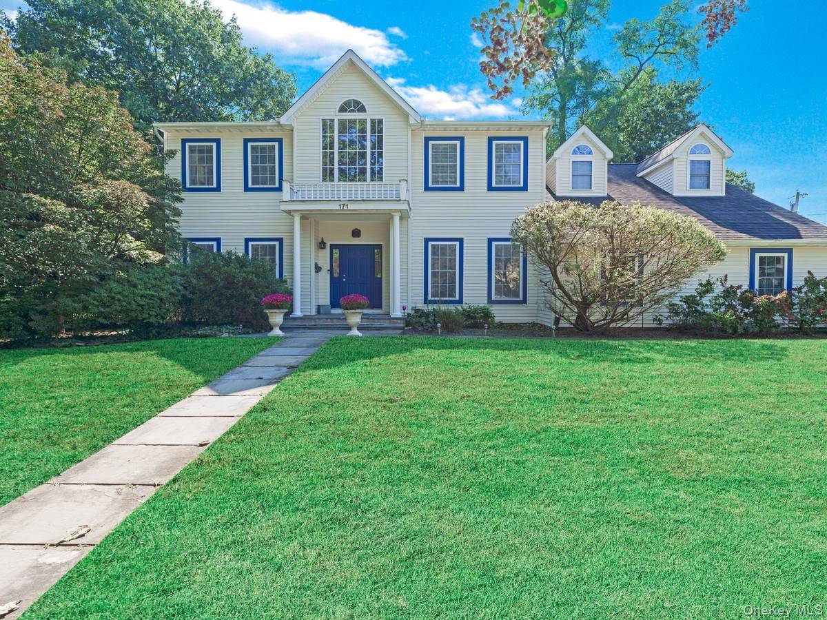 This is a beautiful Center Hall Colonial in Historic Sea Cliff.
