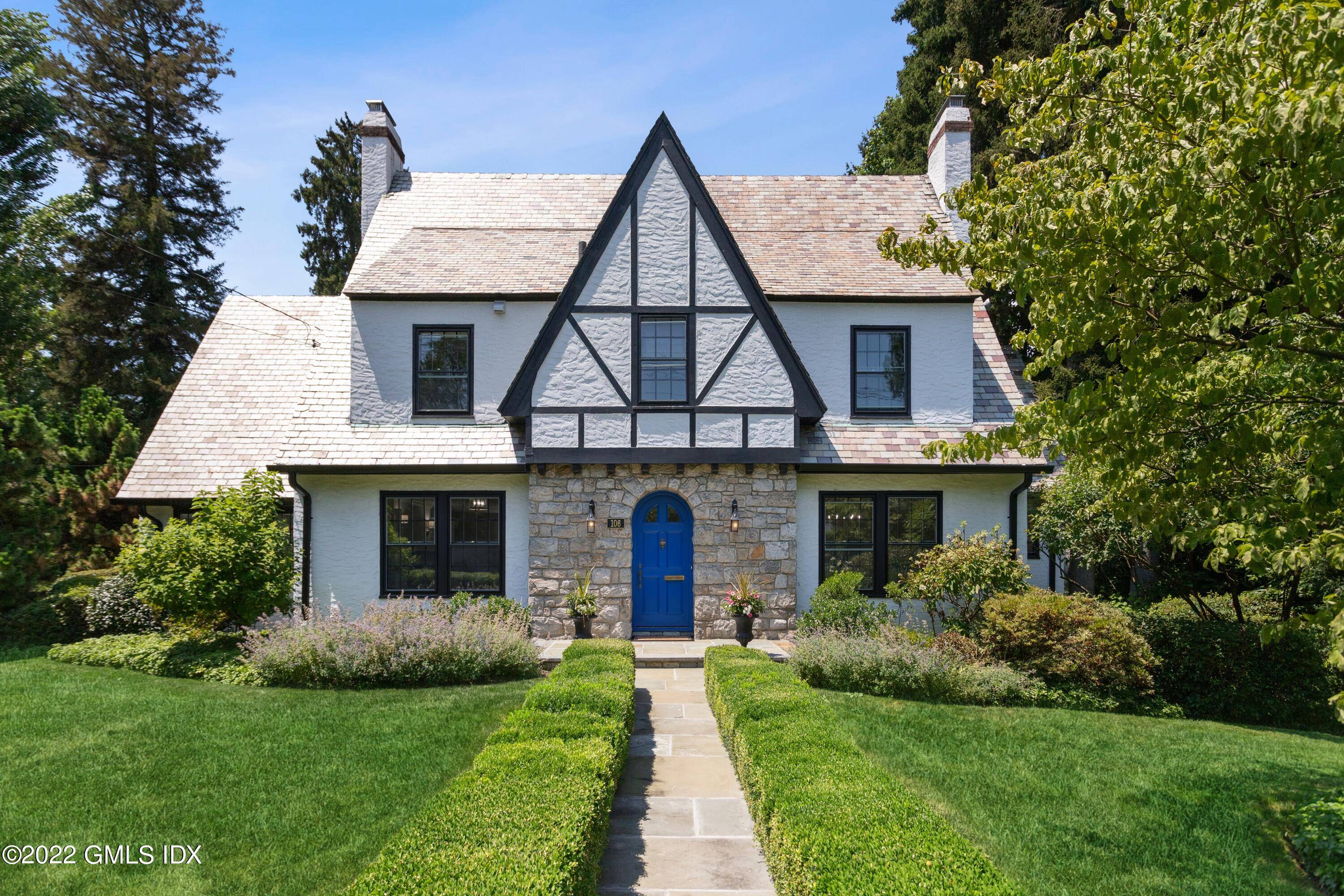 Superbly renovated totally modernized in 2022, this classic Tudor home is sited on parklike acreage on a premier in town street only moments to schools, train, town hospital.