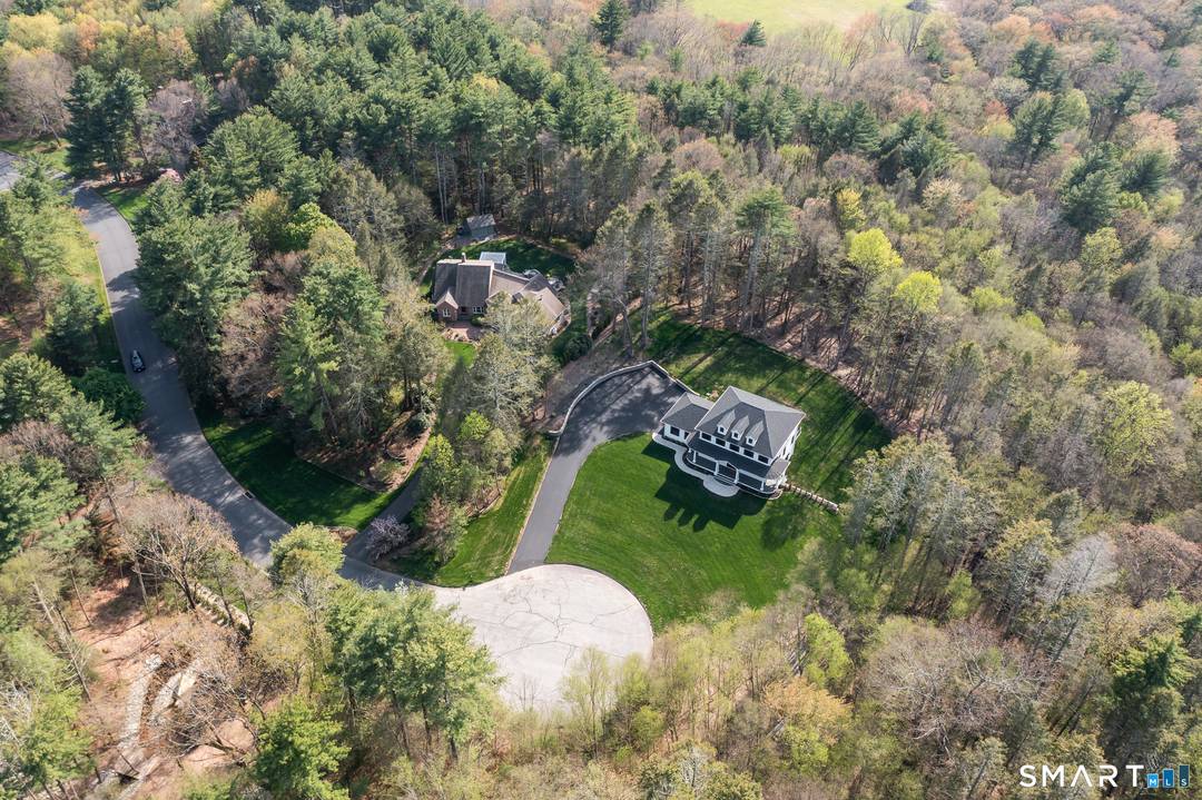 This statuesque beauty is privately situated atop a lightly sloping hill presiding over a quiet cul de sac in a desirable neighborhood.