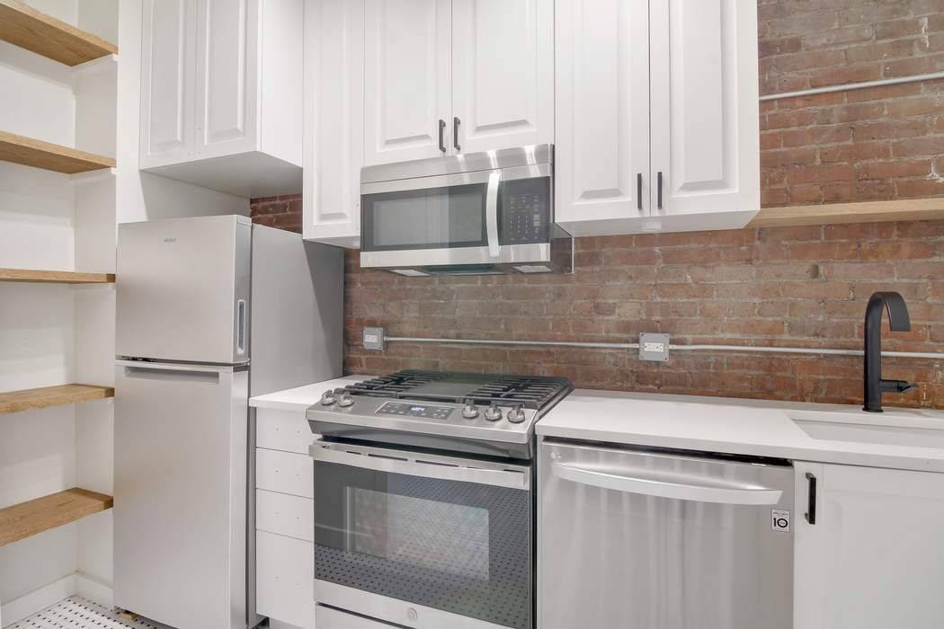 This is a beautifully renovated triplex in a historic brownstone, with 4 large bedrooms and 2 baths on a beautiful and quiet block.