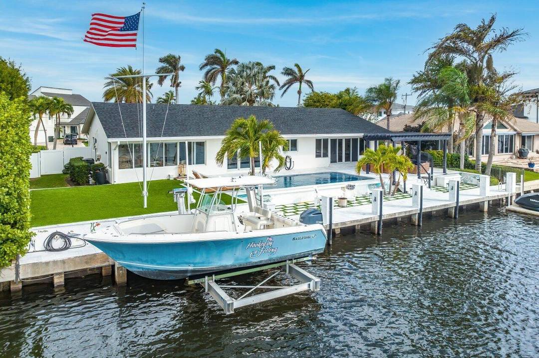Turnkey furnished rental on 100 feet of waterfront at one of South Florida's best kept secrets, Inlet Cay of Ocean Ridge.
