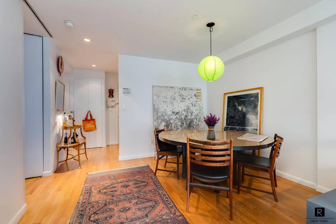 Bright, well designed 1 bedroom condo with private balcony and in unit washer dryer in the heart of the East Village.