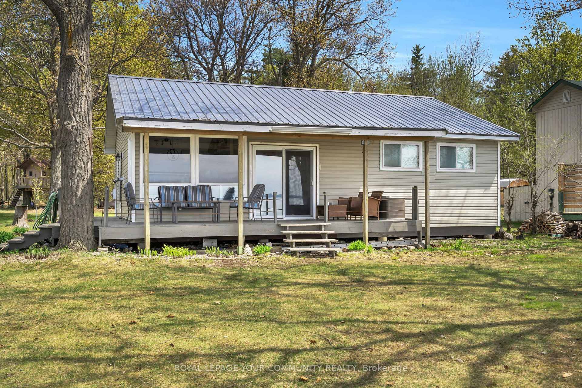 Awesome Lake Simcoe Direct Waterfront Family Cottage on the highly sought after south shore of Fox Island on a Land Lease Lot.