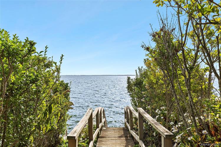 Here s your opportunity to own a charming beach cottage nestled on a quarter acre lot in Laurel.