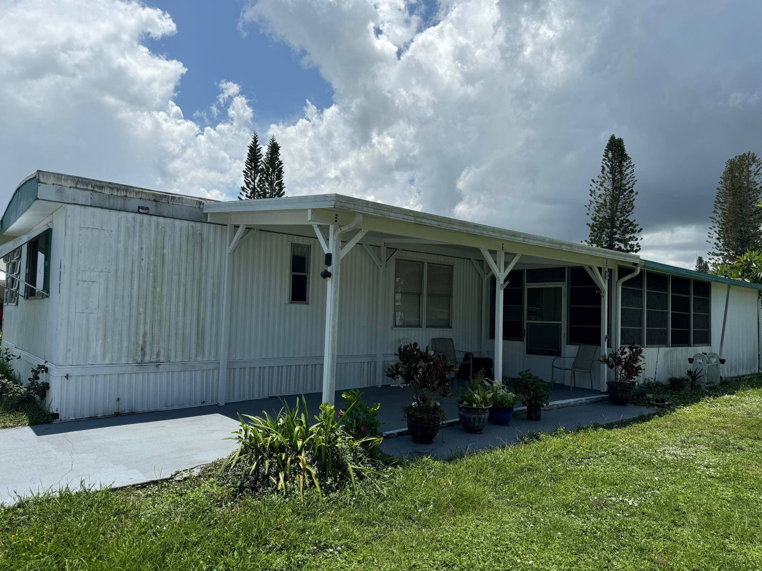 Fully furnished and turnkey home with 2 Bedrooms and 2 Baths, large florida room off of living room, screened in patio with attached shed that includes washer and dryer.