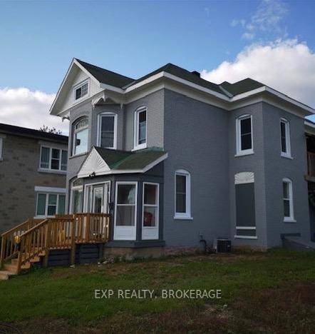 Versatile 2 Storey Property with Commercial Zoning Grandfathered Residential Use.