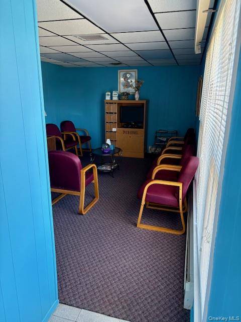 Office building with 4 rooms, 2 baths, reception area and waiting room.