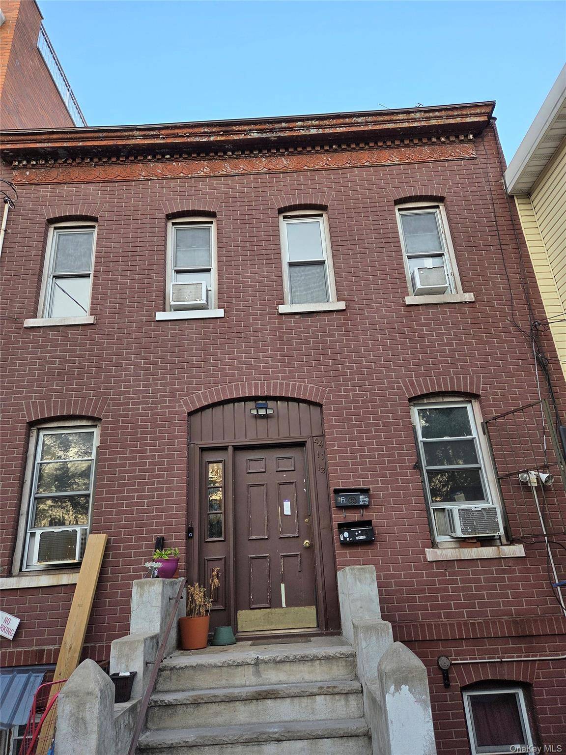 Legal two family brick property for sale.