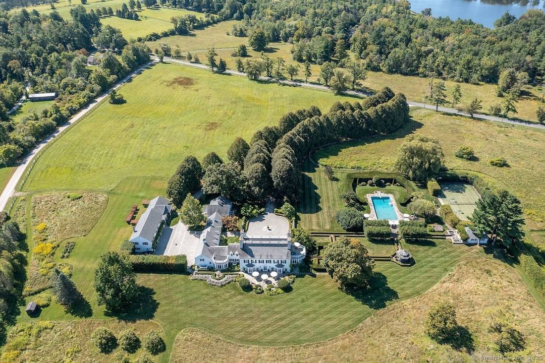 Perched on more than seventy acres of rolling meadows and sculpted gardens, Linden Hill Farm stands as one of the most distinguished country estates in the region.