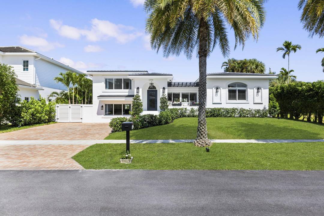 Welcome to your dream home nestled in the prestigious Golden Triangle neighborhood of East Boca Raton.