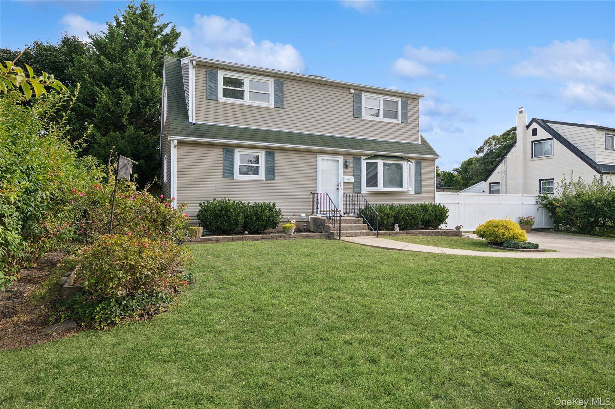 Welcome to this expanded 4 bedroom, 2 bath Cape in Centereach featuring a full basement and freshly painted interior.