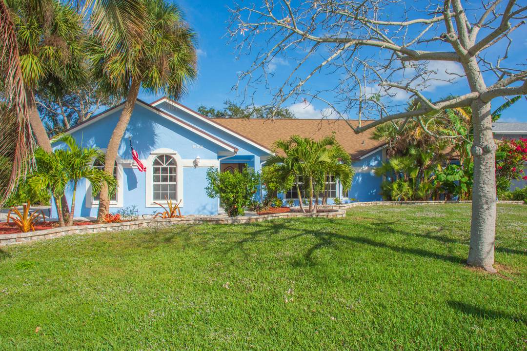 Experience ideal coastal living in this 2 bedroom home with a convertible den, offering over 100 feet of intracoastal water frontage and a 30 foot dock for boating and water ...