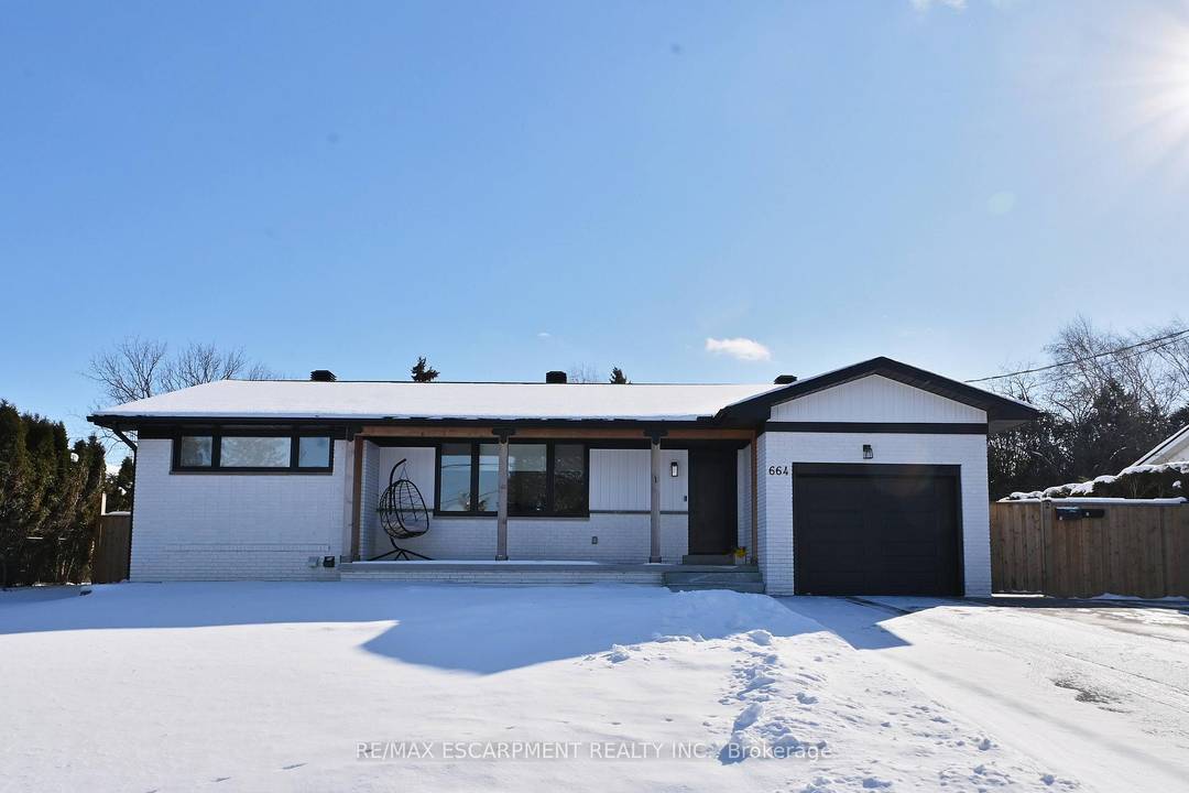 LOCATION ALERT ! Beautiful and fully renovated lower level unit on a tree lined street complete with a fully fenced private side yard !