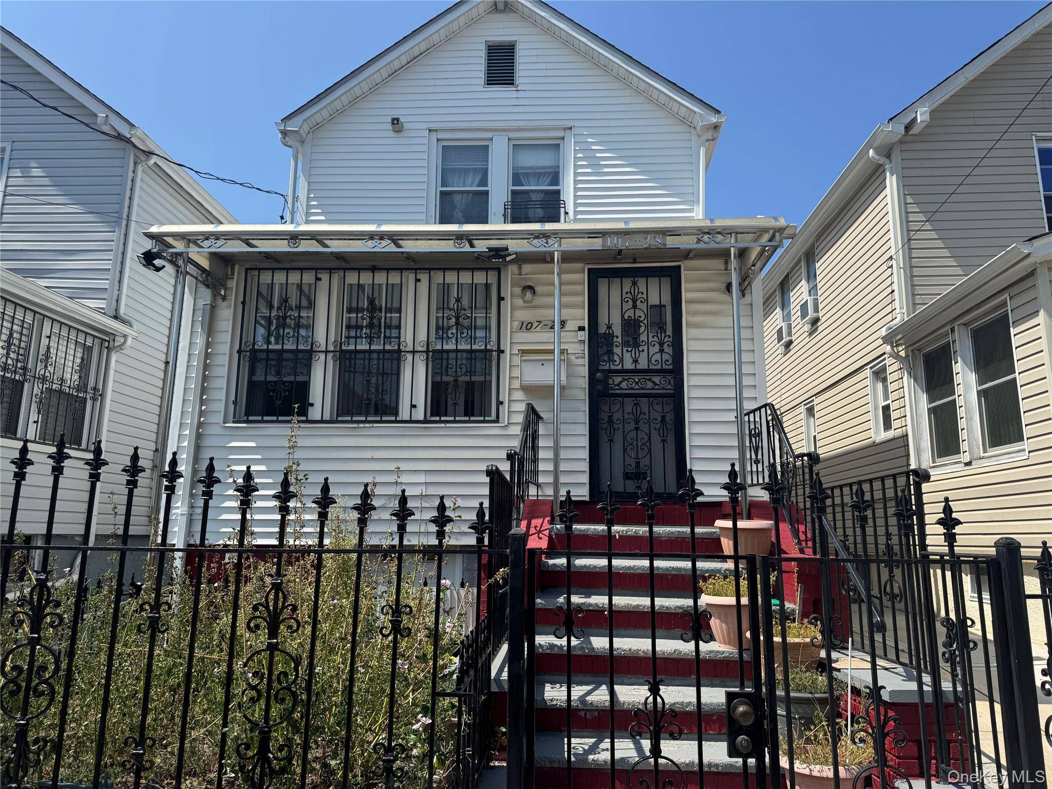 Nestled in the heart of Ozone Park, this delightful Colonial style single family home, built in 1935, beautifully blends classic design with potential for personalization.