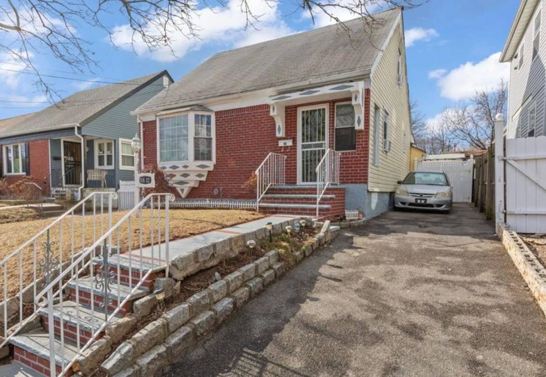Welcome home to this beautifully expanded four bedroom single family Cape style home situated on a hill in the heart of Cambria Heights.