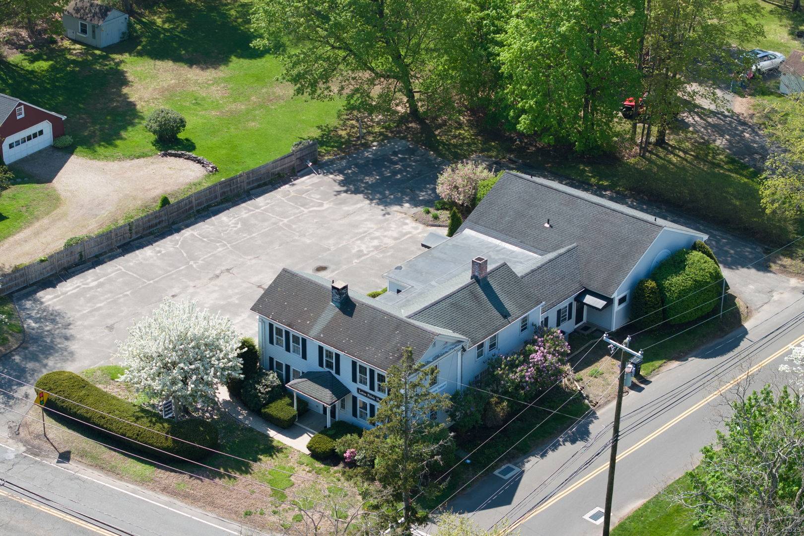Charming and versatile property in the heart of Canton, CT, offering exceptional versatility and high visibility from Route 44 right across from Canton Green.