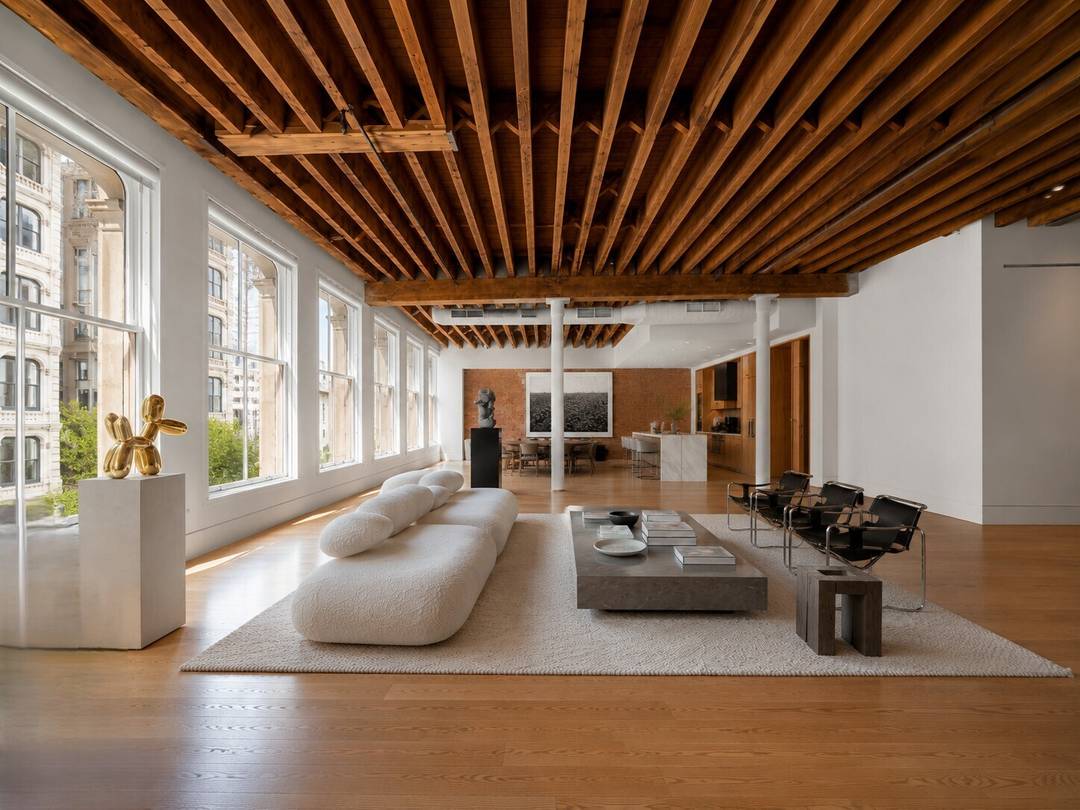A rare full floor loft in one of SoHo s most discreet and architecturally significant boutique condominiums.