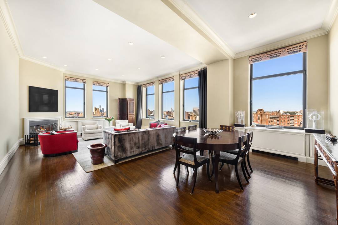This duplex penthouse residence feels like a townhouse in the sky, with a gracious entry hall leading to the living dining space, kitchen and two bedrooms on the first floor.