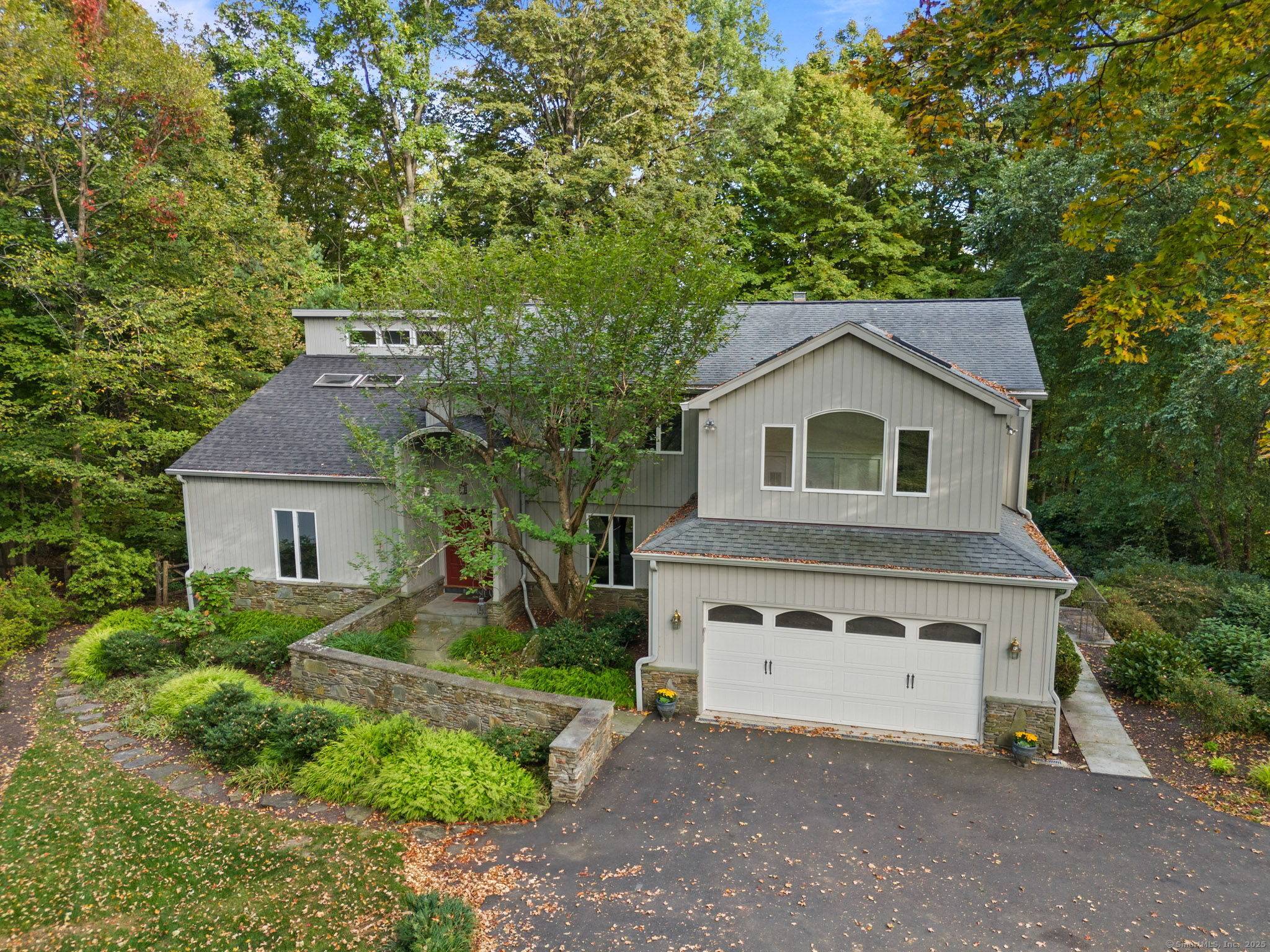 Peaceful contemporary living awaits at this unique home, set on a one acre lot with direct access to the Canal Road path.