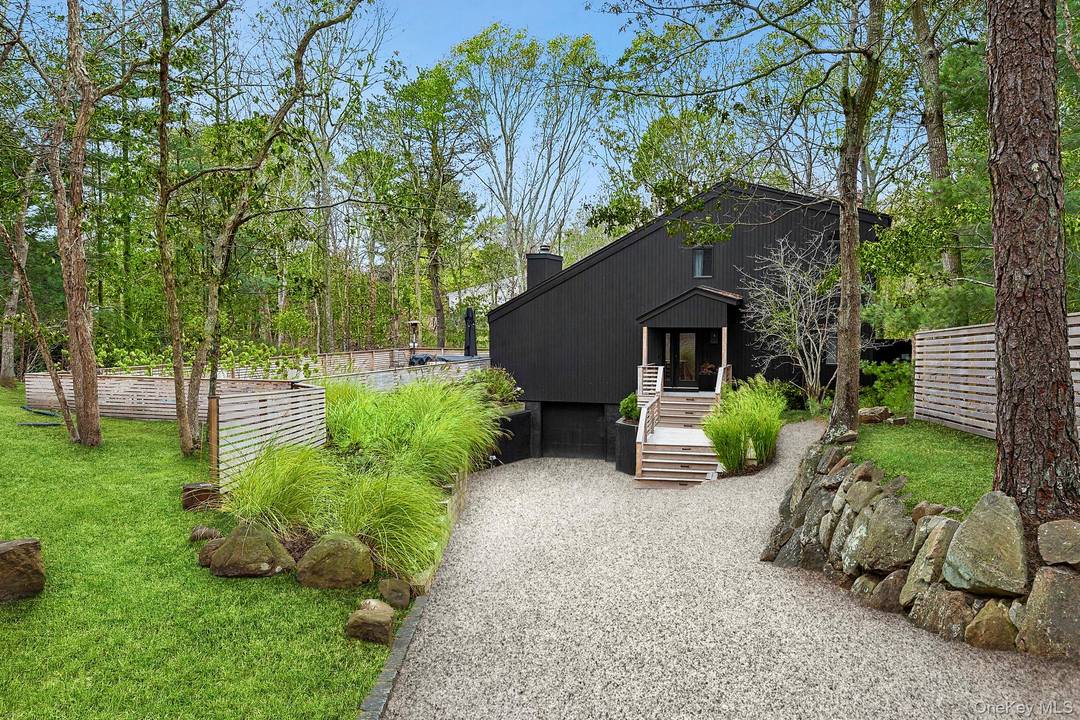 This beautifully updated contemporary sits on a quiet cul de sac in the near NW Woods.