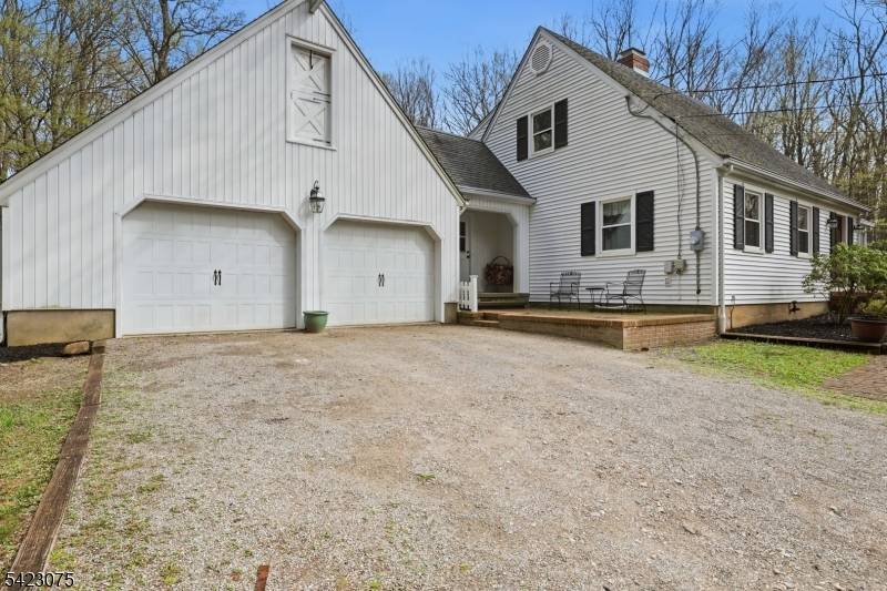 Modernized and updated Cape Cod with 1st floor primary bedroom is located on a private road, tucked away in the Laketown area of Washington Twp.