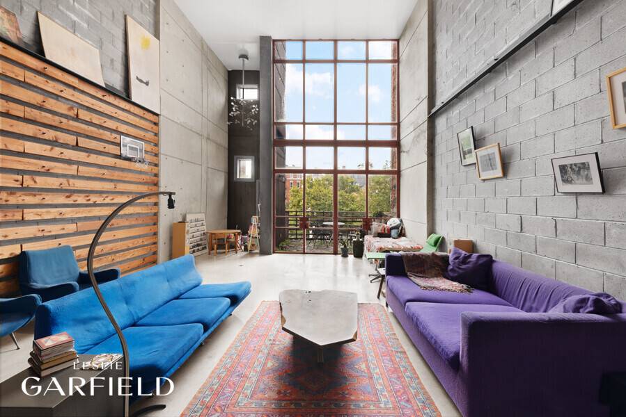 56 East 1st Street is a spectacular, 22 wide, 3 unit, industrial chic downtown property.