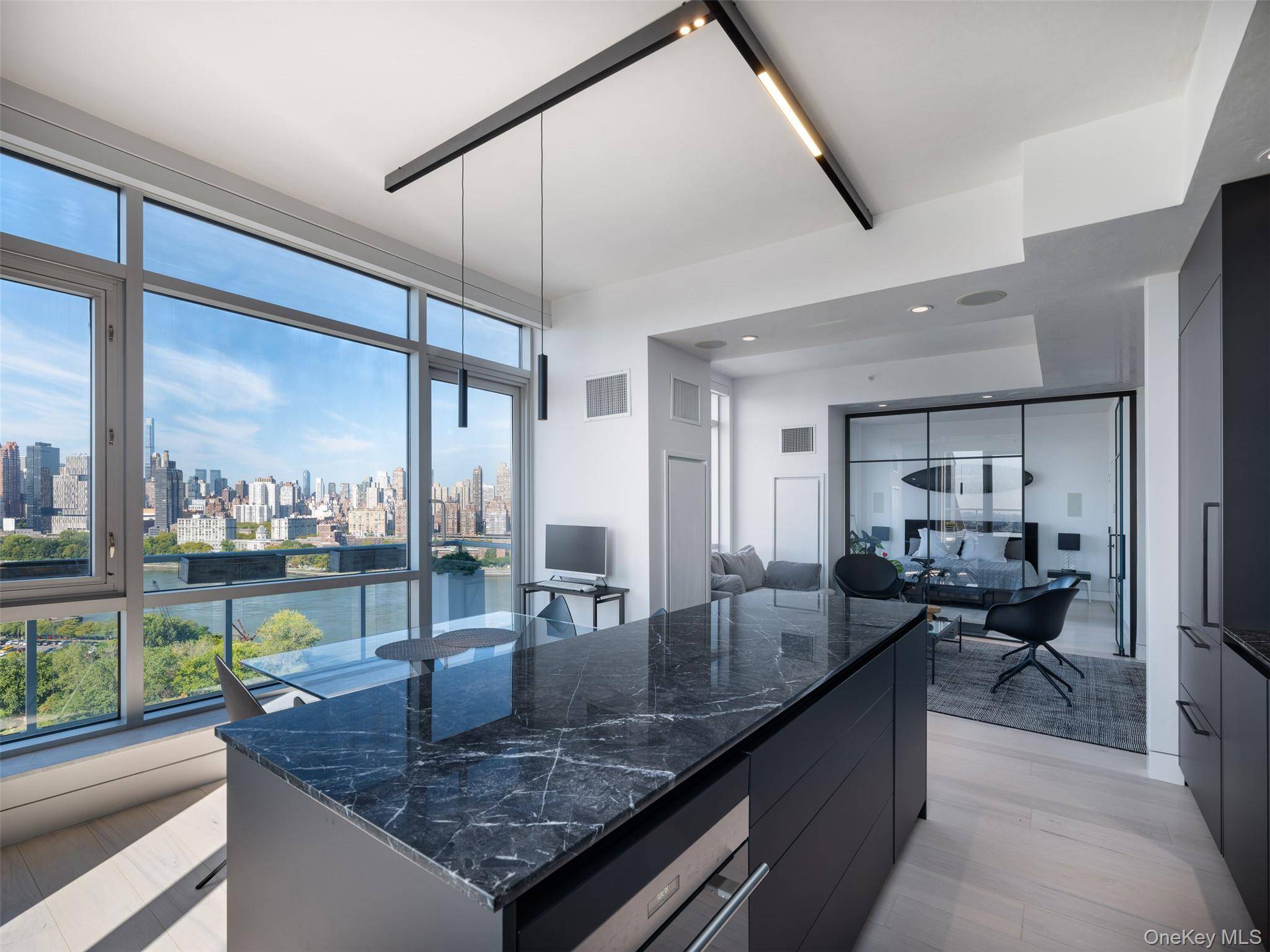 Rising high above the East River, Residence 18B at East River Tower is a rare offering one of only two homes on the 18th floor.