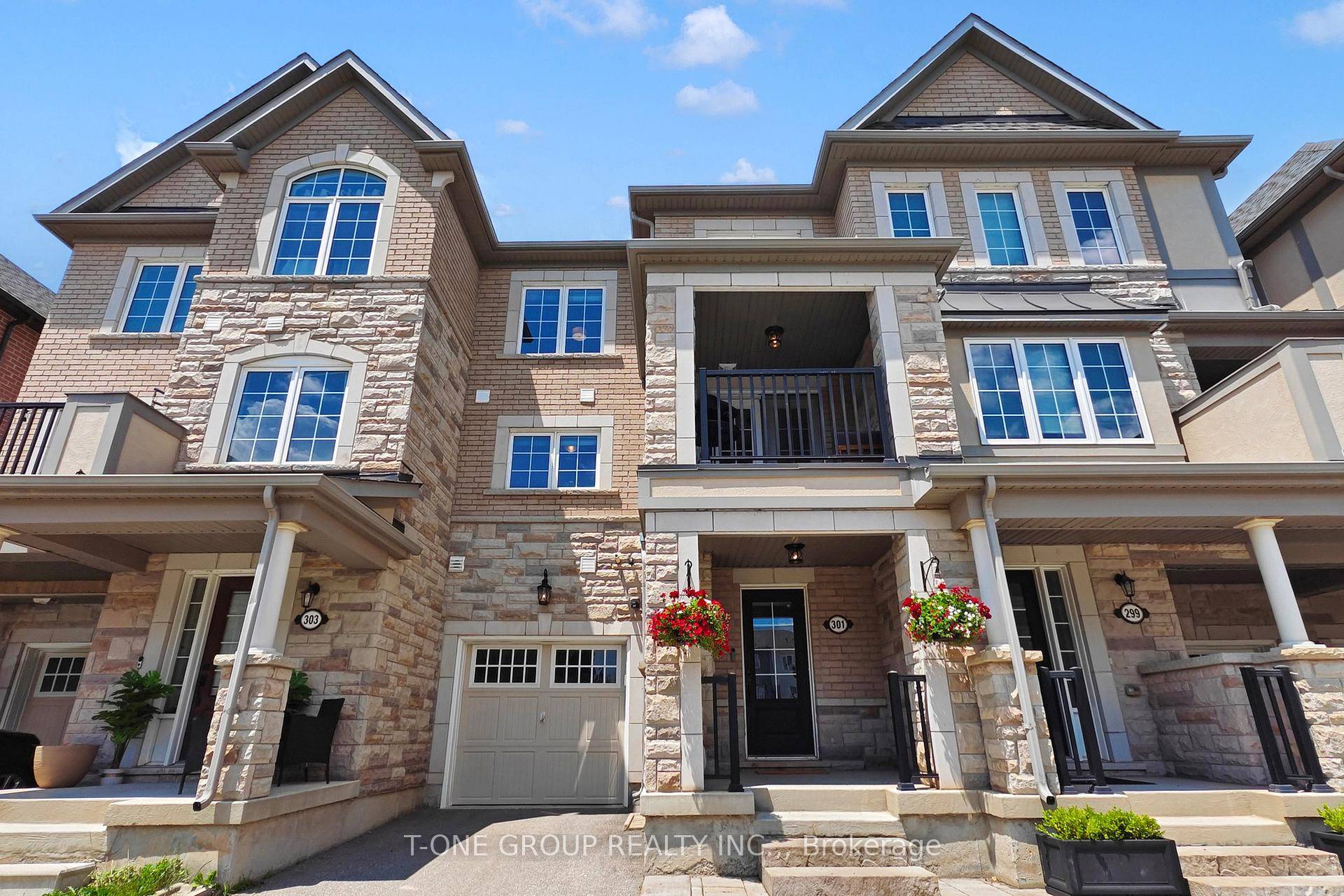 Welcome To 301 Ellen Davidson Drive, A Bright And Beautiful South Facing Freehold Townhouse NO MAINTENANCE FEES Offering Stunning Views And Natural Light All Day Long.