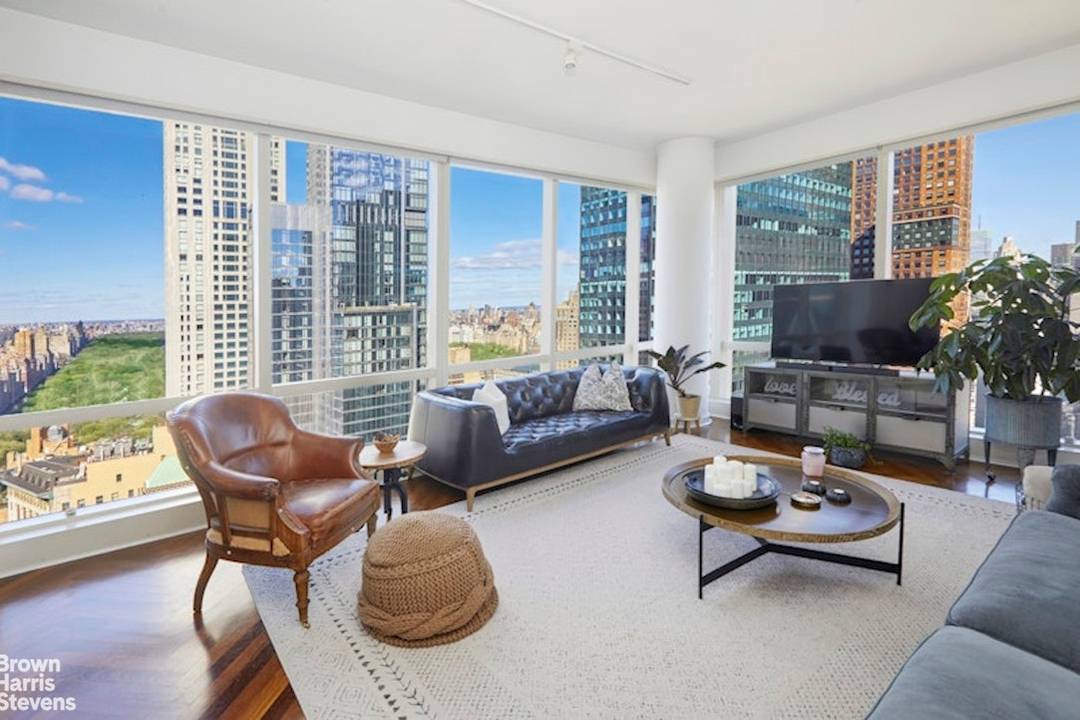 This fabulous 3 bedroom, 3 bath corner residence at the Park Imperial offers beautiful Central Park and cityscape views through wraparound windows with dramatic 10 foot floor to ceiling glass.