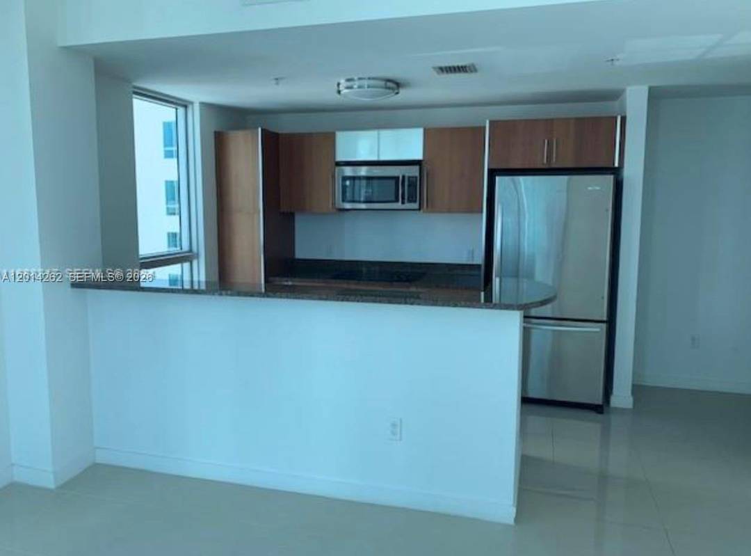 Discover this spacious 1 bedroom, 1 bath corner unit with stunning city and bay views.