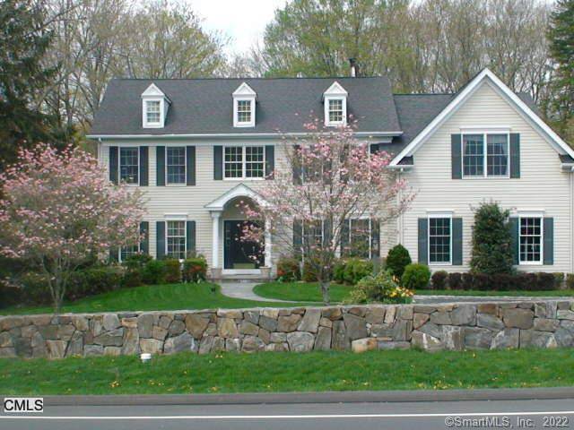 Stately newer colonial home sitting on 2 3 acre level lot.