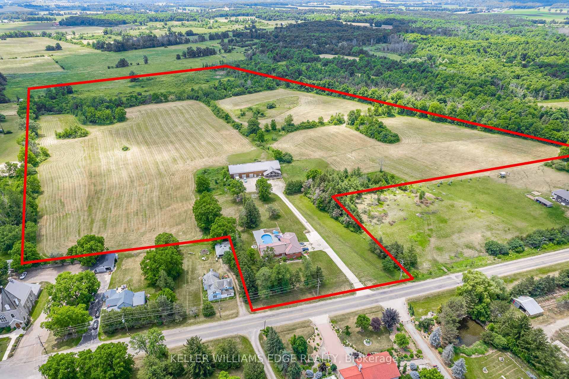 The TOTAL PACKAGE ! ! ! 6000 sq ft outbuilding amp ; a 2200 sq ft bungalow, with a grade level walk out basement, all situated on 42 picturesque acres.