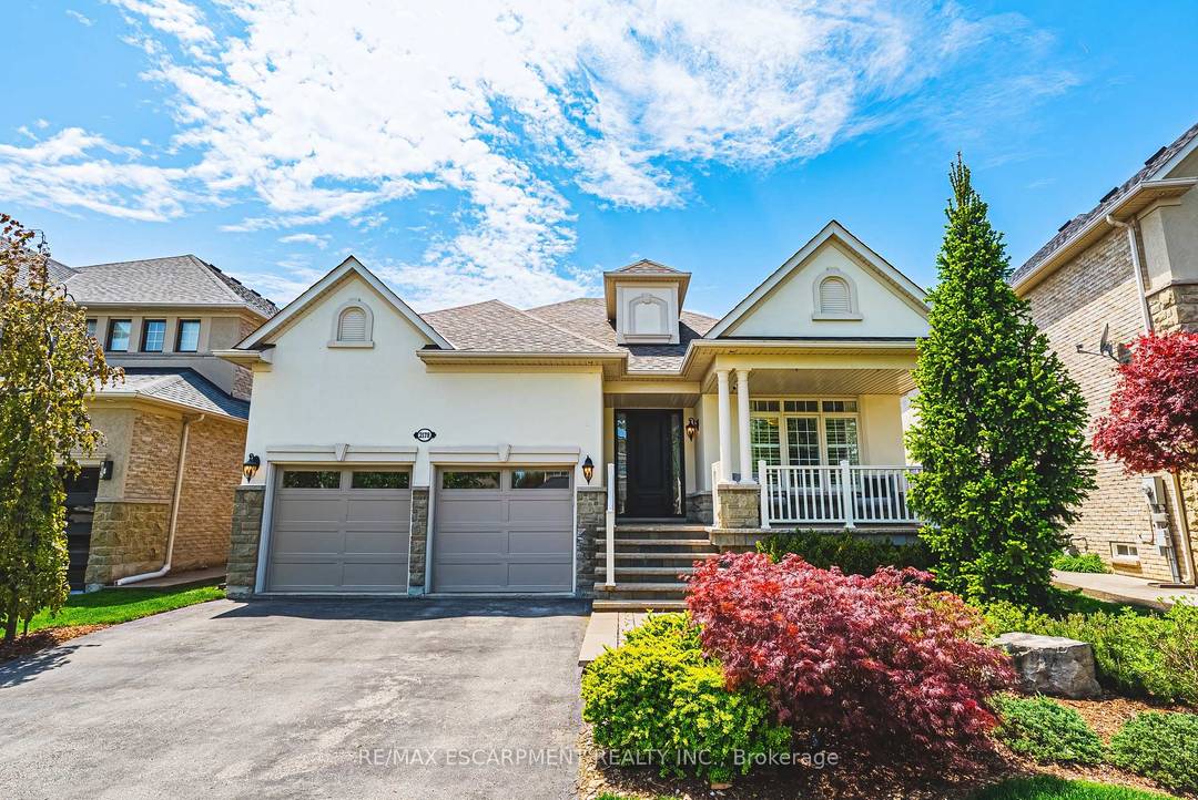 This exceptional Millcroft bungalow boasts 2 bedrooms PLUS a den, a double car garage and an incredible backyard oasis with a heated in ground pool !
