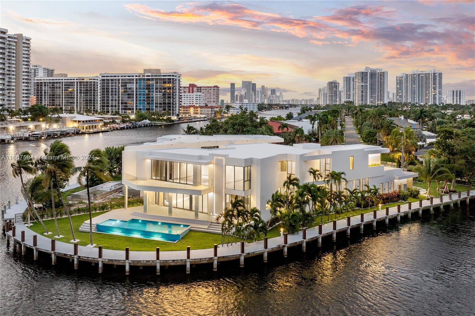 Welcome to this BRAND NEW architectural gem located in the exclusive waterfront community of Golden Isles in Hallandale Beach.