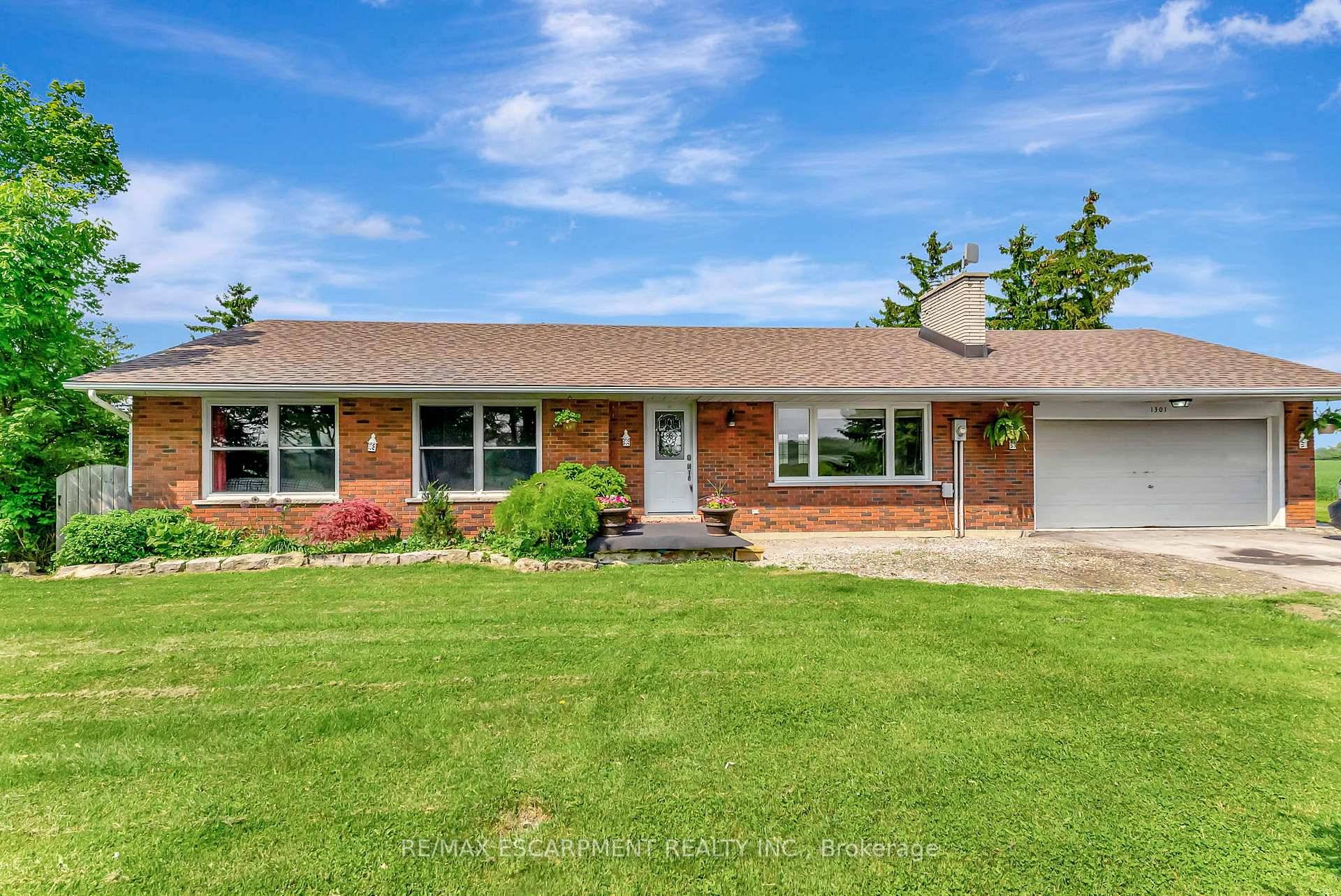 Stunning all brick bungalow nestled on a high elevation lot with beautiful views.