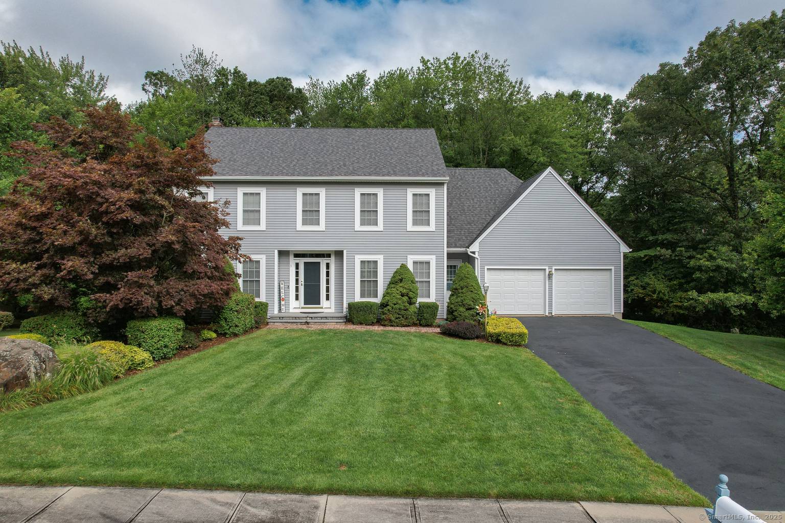 Welcome to this beautifully maintained Colonial, ideally situated on a quiet cul de sac within a six home subdivision featuring underground utilities and sidewalks.