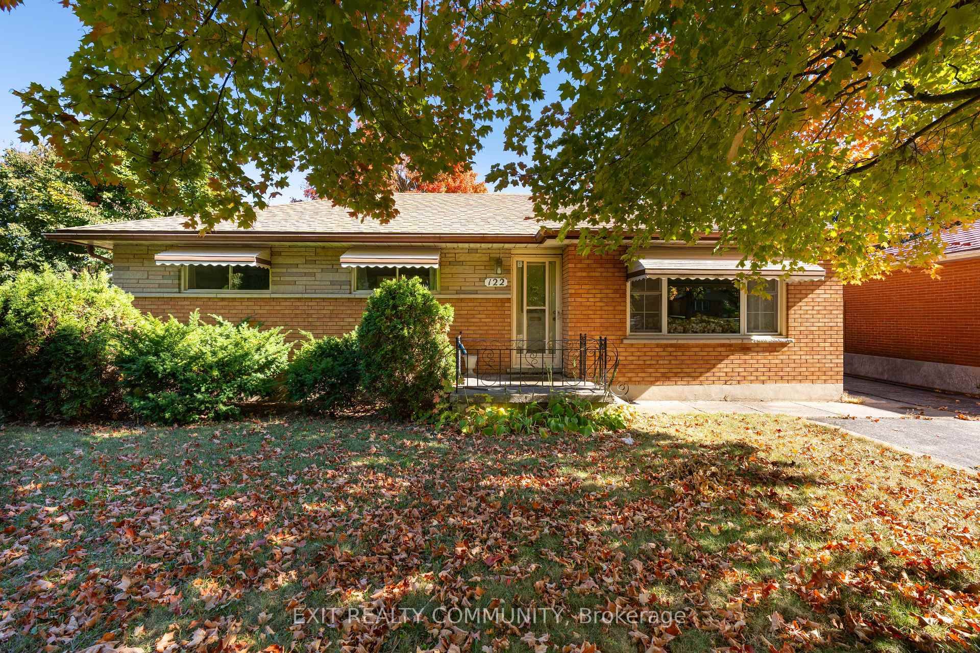 A peaceful and serene tree lined street in a family friendly neighborhood that is minutes away from everything.