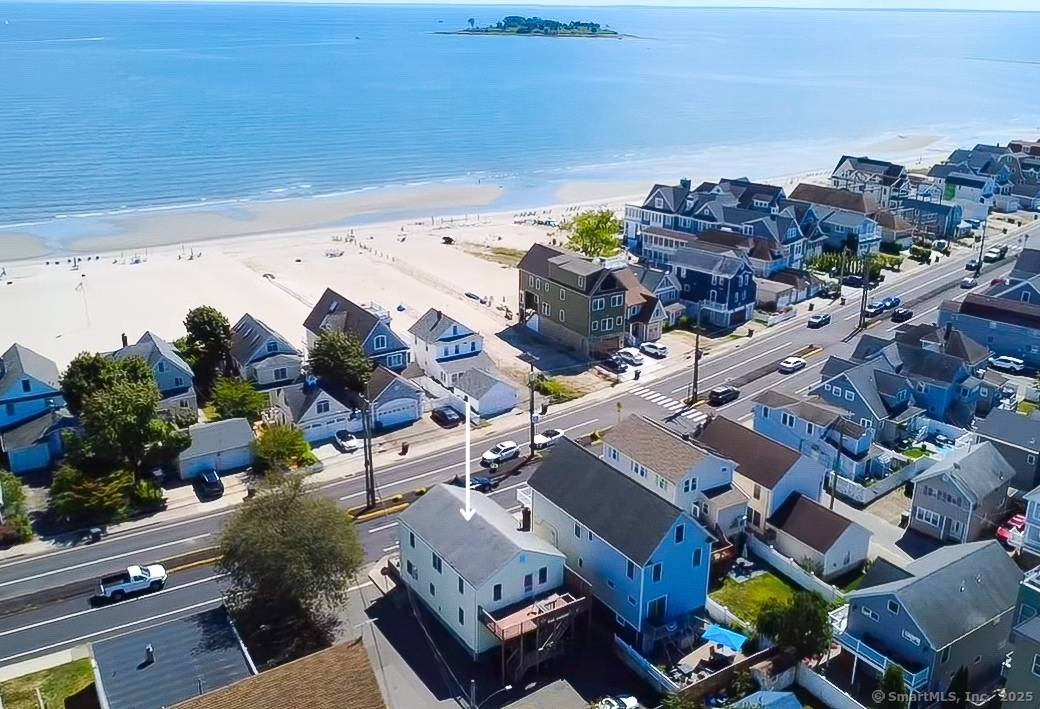 Don't miss this rare chance to own a charming 2 family home directly across the street from beautiful Silver Sands Beach in Milford, CT.
