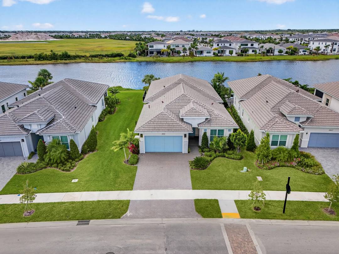 This beautifully appointed 3 bedroom plus office, 3 bath home offers an open and airy floor plan with a bright coastal feel and stunning wide water lake views.