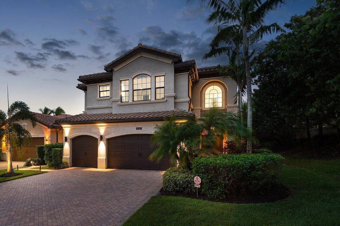 Experience elevated lakefront living at 16491 Gateway Bridge Drive in The Bridges of Delray Beach.