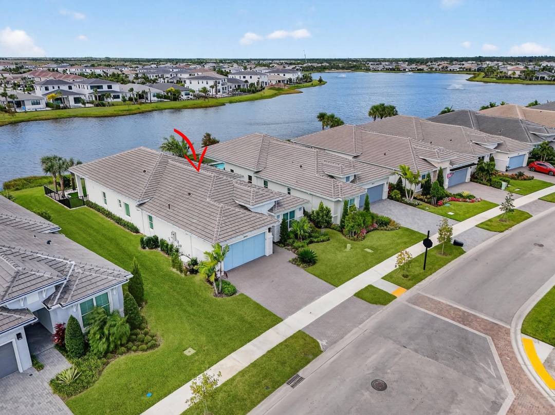 This beautifully appointed 3 bedroom plus office, 3 bath home offers an open and airy floor plan with a bright coastal feel and stunning wide water lake views.