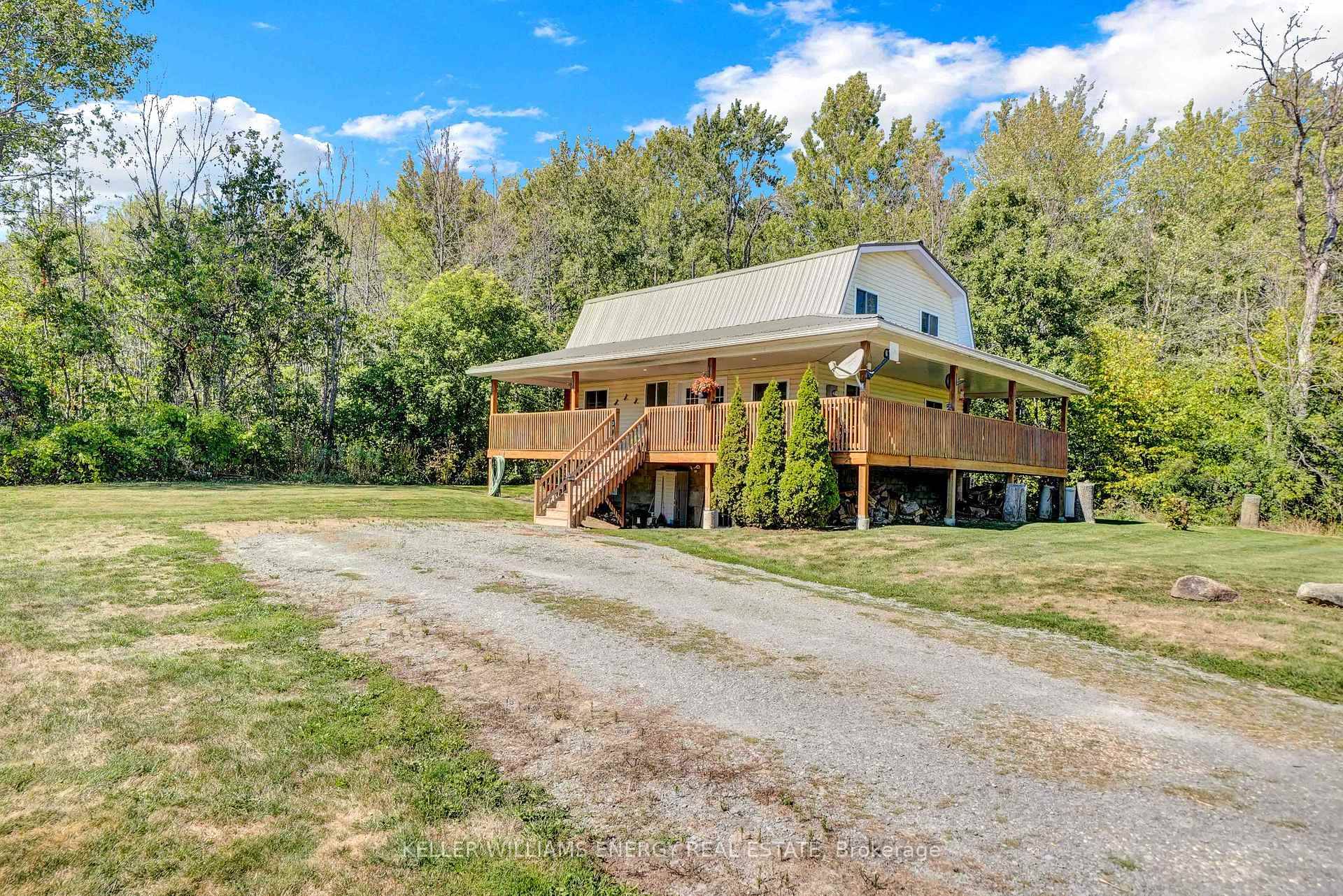 Escape to nature without sacrificing modern comforts in this beautifully updated two storey farmhouse nestled on 12 acres of protected forest in the heart of Prince Edward County.