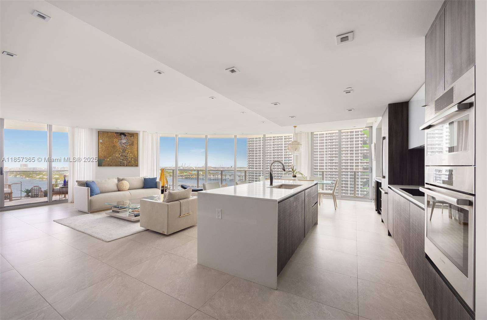 This upscale corner residence at Aria On The Bay combines luxury, comfort, and breathtaking views of the bay and Miami skyline.