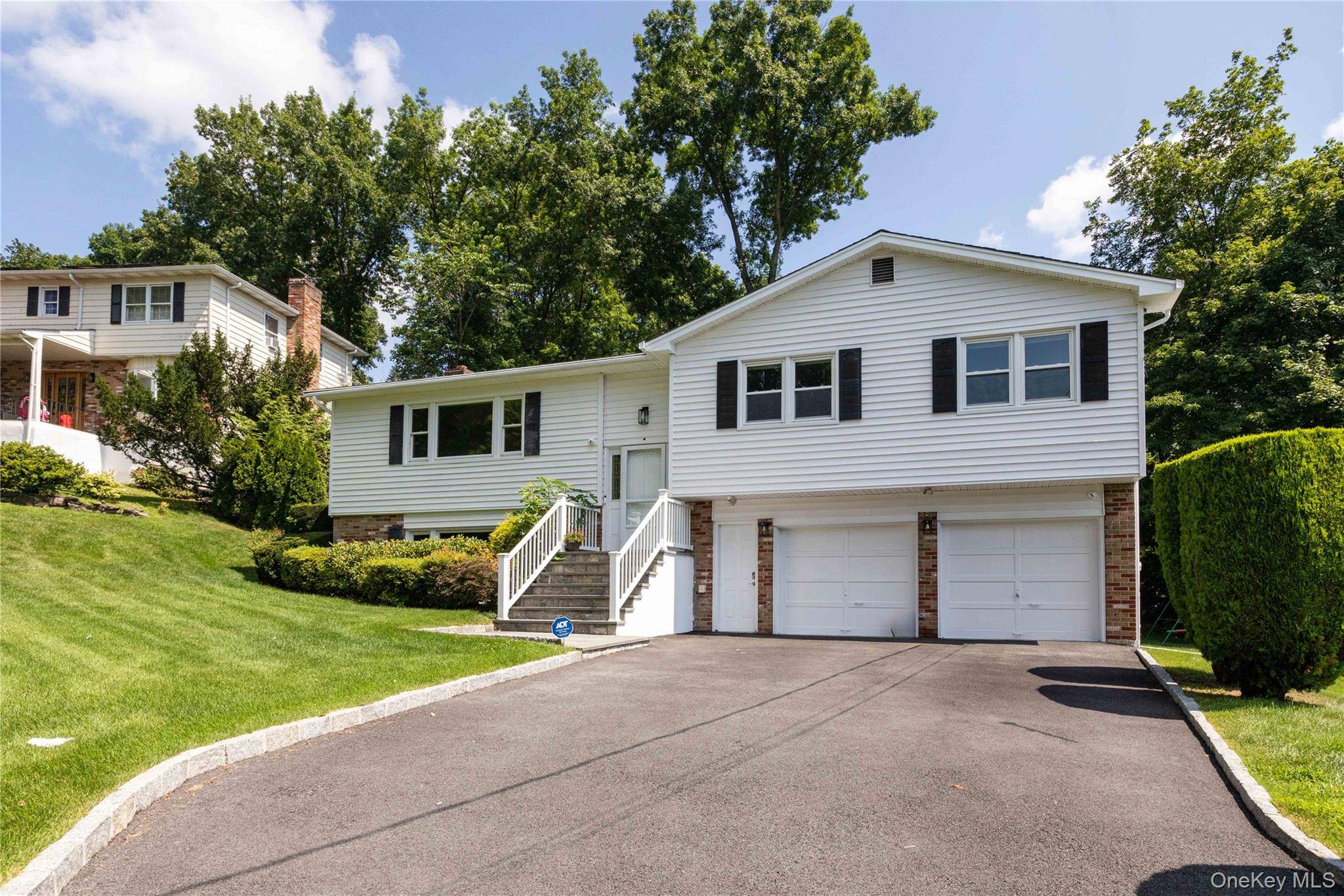 Welcome to this beautifully renovated single family home located at 22 Jason Lane, nestled in a cul de sac in the charming town of Mamaroneck.
